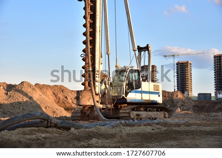 Vertical tamrock pile foundation drilling machine. Drill rig at construction site. Ground Improvement techniques, vibroflotation probe. Vibro compaction method. Piling Contractors