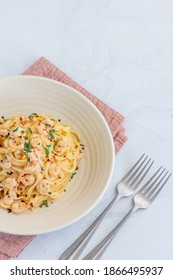 Vertical Top Down Photo Of Italian Shrimp PAsta In A Bowl With Forks