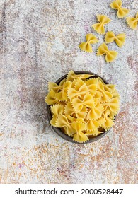 Vertical Top Down Photo Of Raw Pasta In A Bowl 