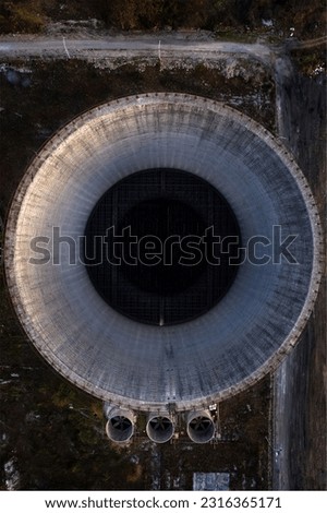 A vertical top view of the large cooling tower resembling a human iris