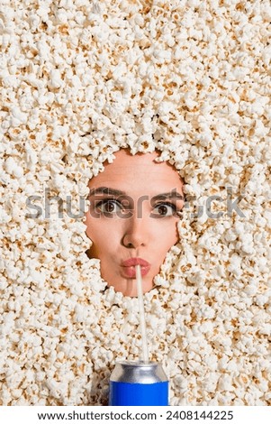 Vertical top view photo of girl sipping soda drink can face buried isolated in pop corn ad background