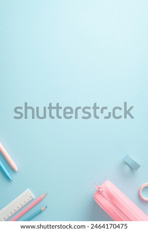 A vertical top-view image showcasing a neatly arranged setting of school supplies, including pencils, a ruler, and a pink pencil case on a pastel blue background