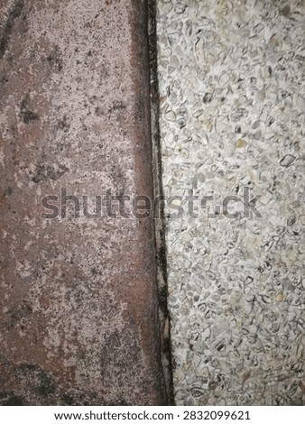 Vertical Two Tone Split Concrete and Pebble Wash Wall Texture Background