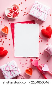 Vertical Valentines Day background with blank paper card mockup, gifts, red hearts, confetti on pink.