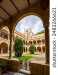 Vertical view of the beautiful 17th century cloister of the Faculty of La Merced, University of Murcia, Spain in mid-day light