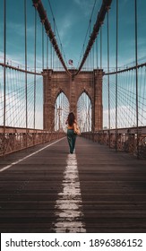 Vertical view from below of Brooklyn Bridge - a hybrid cable-stayed suspension bridge in New York City, spanning the East River between the boroughs of Manhattan and Brooklyn. 