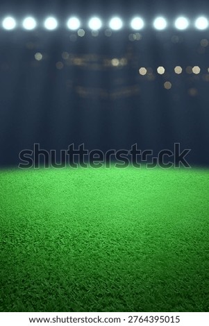 Vertical view of an empty green grass field in a sports stadium at night, illuminated by bright floodlights with a dark bokeh background, ready for a football or soccer match