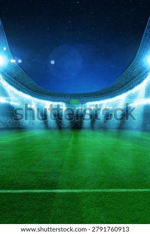 Vertical view of an empty green soccer field in a huge sports stadium at night under bright spotlights and a starry sky before a match. Professional arena background with copy space for design.