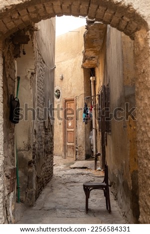 Vertical view of empty old traditional street in arab poor country in daily life
