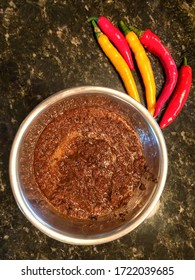 Vertical View Of Fresh Peppers And Piri Piri Sauce