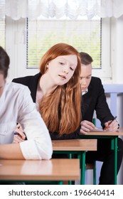 Vertical View Of A Girl Cheating On Exam