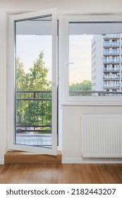 Vertical View Of Living Room With Double Glazed Window Frame In Apartment. Bedroom Balcony With White Metal Or Pvc Door. Concepts Of Residential Building, Apartment Repair, Renovation In Modern House