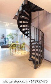 Vertical View Of A Metal Dark Spiral Staircase