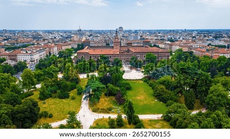Vertical view of Sforza Castle’s clock tower in Milan, showcasing medieval architecture, red bricks, and historic design. Perfect for travel, tourism, and cultural heritage visuals.