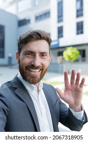 Vertical View Smartphone Camera Caucasian Bearded Businessman Speaks On Phone Using A Front Camera On A Video Call. Employee Business Man Talking On Webcam. Conversation Of An Office Worker In Suit