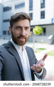 Vertical View Smartphone Camera Caucasian Bearded Businessman Speaks On Phone Using A Front Camera On A Video Call. Employee Business Man Talking On Webcam. Conversation Of An Office Worker In Suit