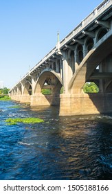 Vertical View Of Tall Bridge Over Rushing Waters In Columbia SC