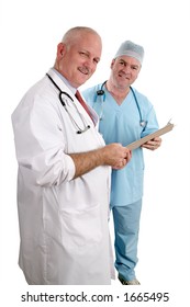 A Vertical View Of Two Friendly Doctors Reviewing A Medical Chart.  Isolated. (focus On Doctor In White Coat)