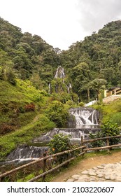 Vertical view of waterfall in the jungle landscape in Colombia. Panoramic view of natural thermal springs in Santa Rosa Cabal valley. Colombia travel destination concept.