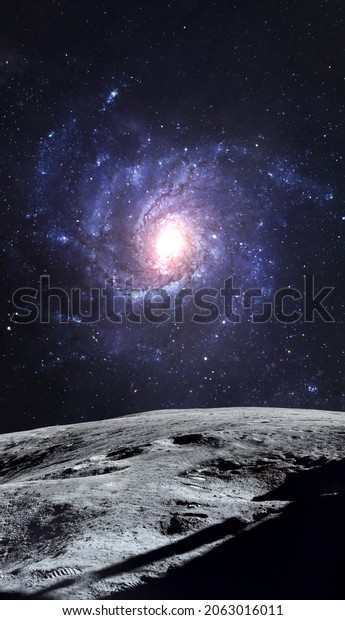 Vertical wallpaper of Moon surface and galaxy on\
background. Full sky of stars and glow nebula. Elements of this\
image furnished by\
NASA