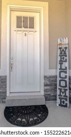 Vertical Welcome Sigh At The Front Door Of A House