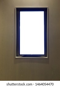 A Vertical White Blank LED TV Screen Installed Onto A Wall.