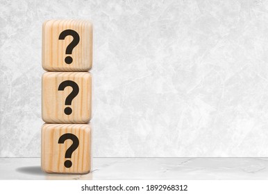 Vertical wooden block in question mark, business teamwork concept