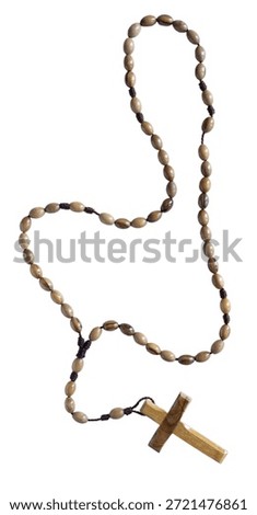 Vertically oriented wood rosary for prayer isolated on a white background.