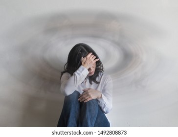 Vertigo Illness With Dizziness In Woman Patient Feeling Dizzy, Faint With Spinning Movement Inside Head From Benign Paroxysmal Positional Vertigo (BPPV), Migraine Headaches Or Hearing Loss Problem