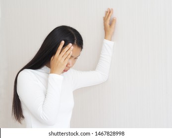 Vertigo Illness And Sick Building Syndrome Or SBS, Brain Atrophy In Asian Woman, She Use Hand Touching Head And Felling Headache Dizzy Sense Use For Health Care Concept.