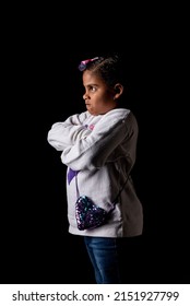 Very Angry African American Girl In Profile Posing On A Black Background