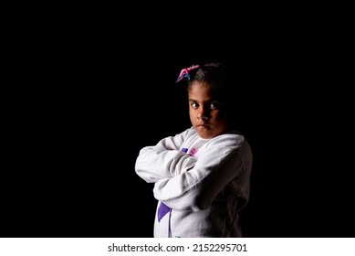 Very Angry African American Girl Posing On A Black Background