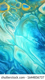 Very beautiful abstract ART background - random free mixing of paints in technique of liquid acrylic and golden powder. Artistic image of swirl ocean surf texture in turquoise green blue tones.