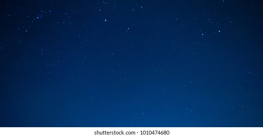 very beautiful panorama night blue sky and star background.with grain and select white balance.