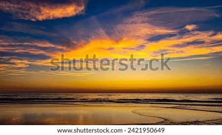 A very beautiful romantic sunset on the Atlantic Ocean in France. Saturated colors.
