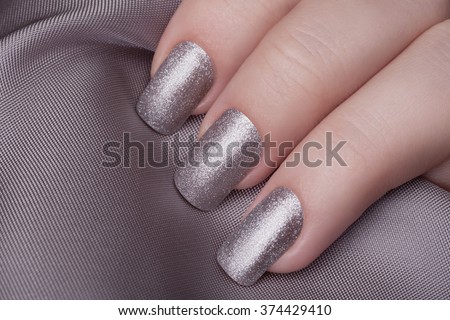 Very beautiful silver metallic nails closeup. 