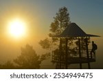 very beautiful view in the morning mountains. view at sunrise. best sunrise. man is at the lookout post on the mountain in the morning