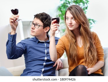 Very beautiful young couple toasting wine glasses - Shutterstock ID 180974426