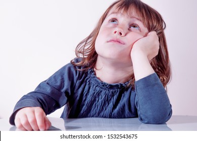 Very Bored Little Cute Baby Girl Looking Tired And Sick. Negative Emotions, Gestures, Body Language Concept.