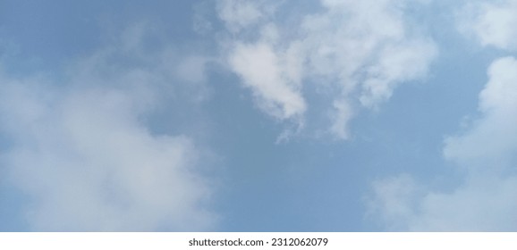 very bright clouds in the blue sky - Shutterstock ID 2312062079