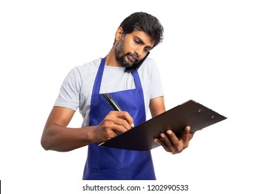 Very busy hypermarket or supermarket employee talking on the phone and checking clipboard writing isolated on white background - Powered by Shutterstock