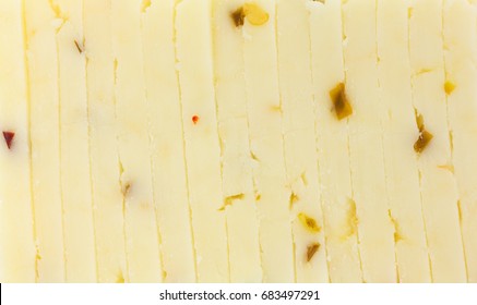 A Very Close View Of Fresh Pepper Jack Cheese Slices.