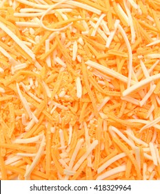 A Very Close View Of Shredded Cheese On Background 