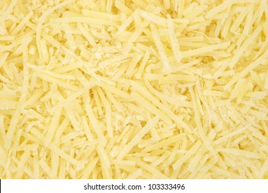 A Very Close View Of Shredded Parmesan Cheese.