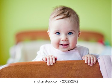 Very Cute Baby Smiles Standing In The Crib