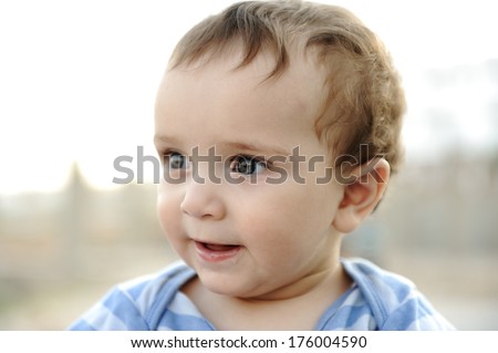 Similar – Image, Stock Photo Little cute boy looking at camera and sticking out his tongue