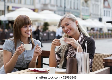 Very Cute Smiling Women Drinking A Coffee Sitting Outside In A Cafe Bistro