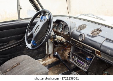 The Very Damaged Interior Of An Old Car From The 1980s