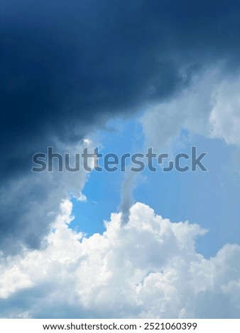 Very dark clouds in which a tornado vortex is born, which symbolizes the beginning of a huge storm
