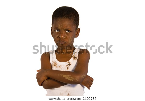 Very dirty African American child with arms crossed - looking angry. Studio shot isolated on a white background.